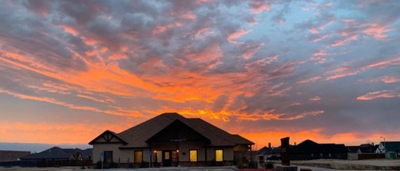 Exterior of Tracy R. Henson-McBee, DDS, PA dentist office in Lubbock, TX during sunset